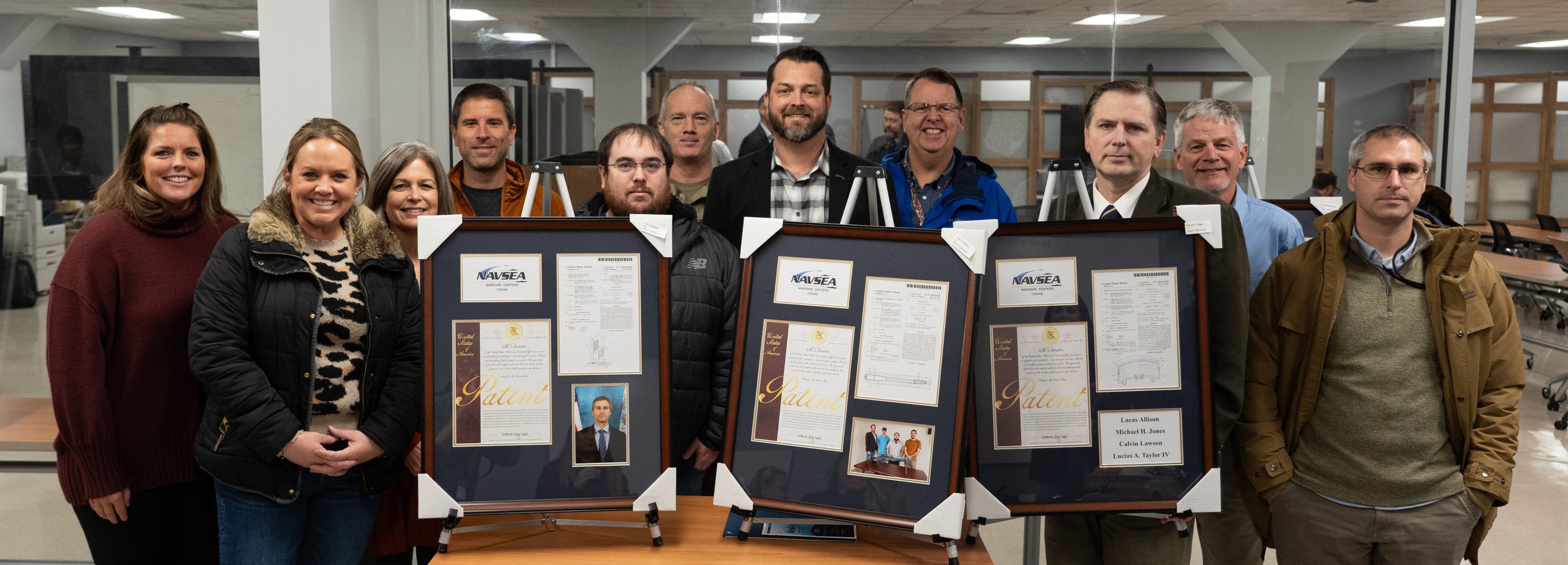 NSWC Crane inventors stand for a group photo at the T2 Inventor Recognition Showcase 